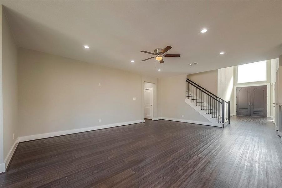 Open concept living room with high ceilings