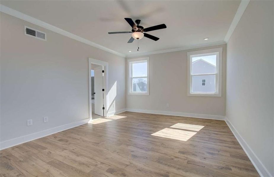 Spacious, unfurnished interior of a new home in The Paddocks at Doc Hughes, Buford (Image 39).