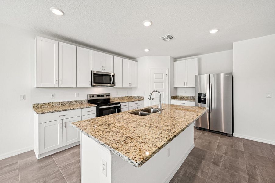 Furnished interior view inside a new home in Hampton Park - Classic Series, Vero Beach (Image 10).