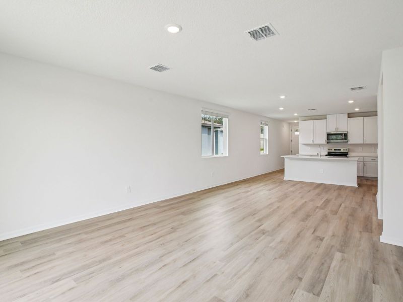 Spacious, unfurnished interior of a new home in The Grove at Stuart Crossing - Premier Series, Bartow (Image 12).