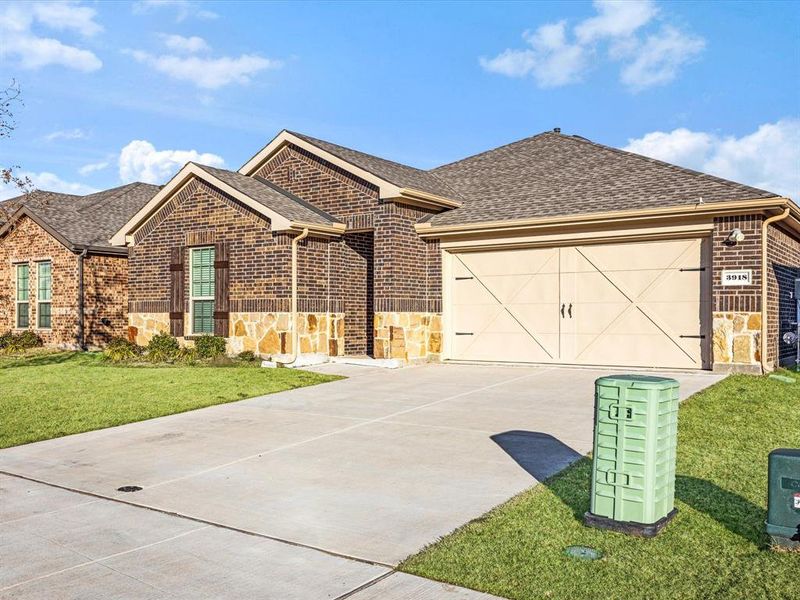 Front exterior of a new home in , Celina, TX, highlighting curb appeal (Image 19). Front exterior of a new home in , Celina, TX, highlighting curb appeal (Image 19).