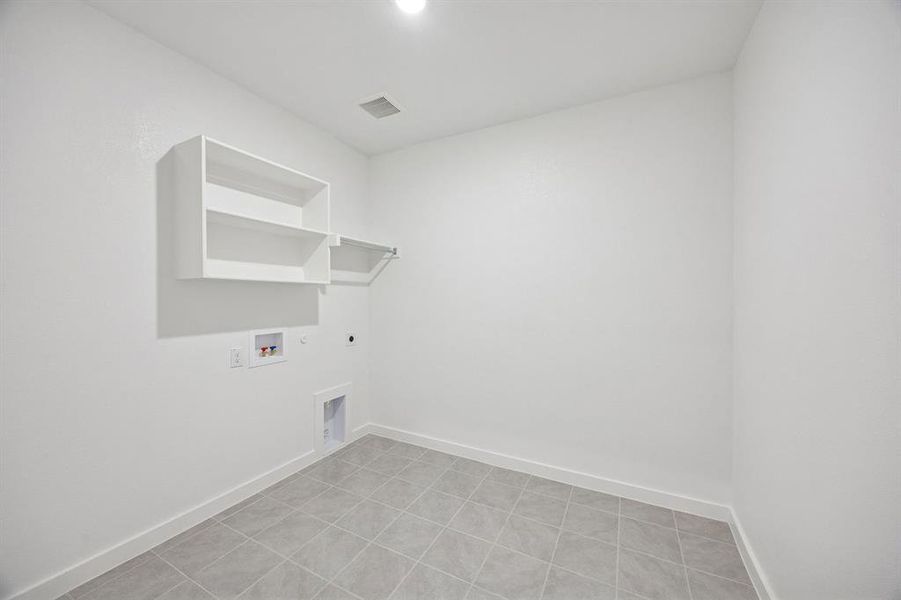 Utility Room in the Wimbledon home plan by Trophy Signature Homes – REPRESENTATIVE PHOTO Utility Room in the Wimbledon home plan by Trophy Signature Homes – REPRESENTATIVE PHOTO