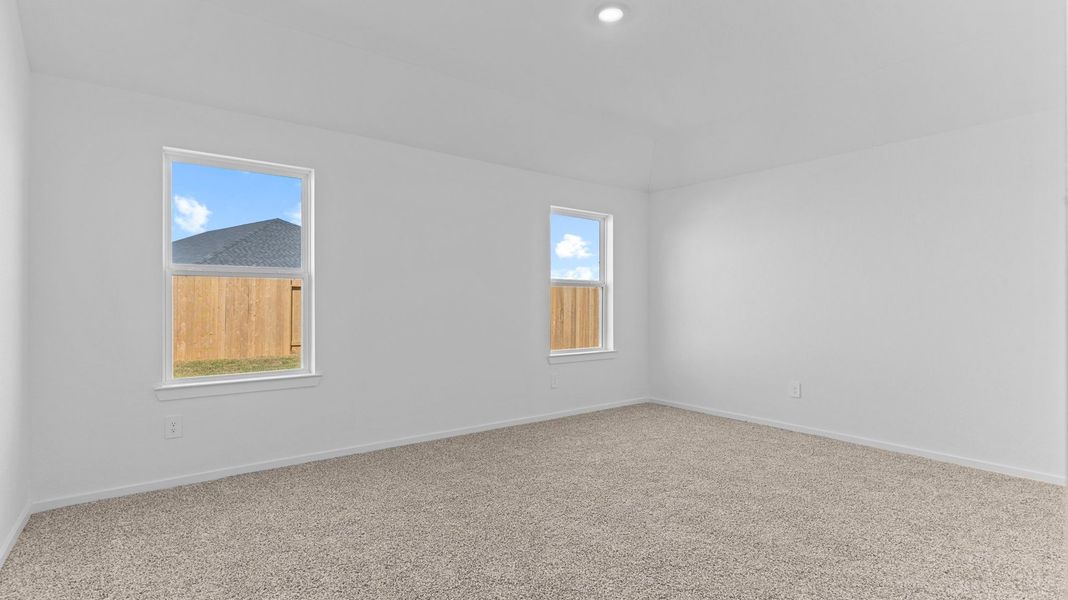 Spacious, unfurnished interior of a new home in Caldwell Crossing, Iowa Colony (Image 11).