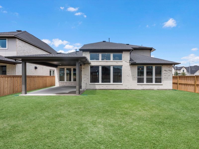 Exterior details and patio area of a home in Dunham Pointe, Cypress (Image 3).