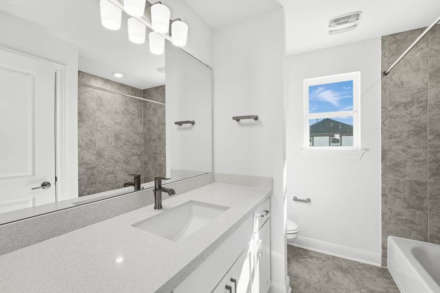 Furnished interior view inside a new home in Travisso, Leander (Image 8).