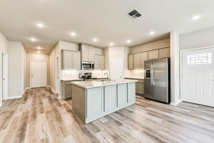 Walking through the front door, you're greeted by an open kitchen and living area, offering stunning views while you cook or entertain guests, all leading out to the expansive balcony.