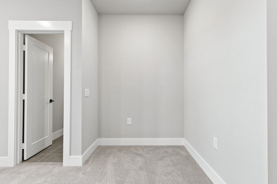 Spacious, unfurnished interior of a new home in The Tribute, The Colony (Image 32).