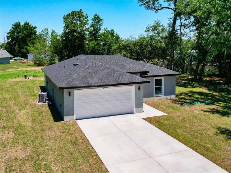 Front exterior of a new home in , Ocala, FL, highlighting curb appeal (Image 16). Front exterior of a new home in , Ocala, FL, highlighting curb appeal (Image 16).