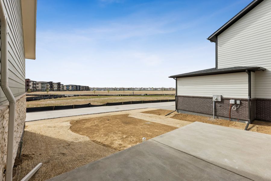 Exterior details and patio area of a home in Painted Prairie Meadow Collection, Aurora (Image 4).