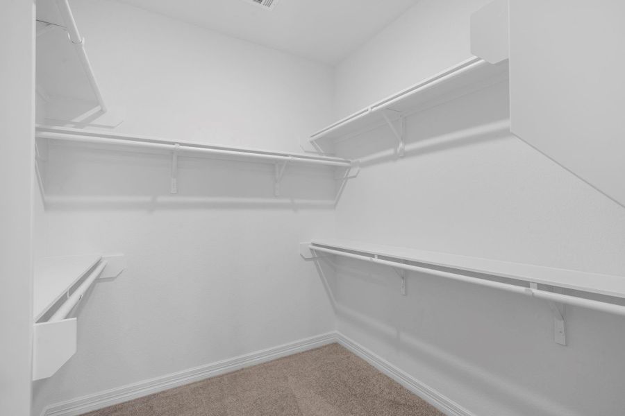 A view of your large primary walk-in Closet