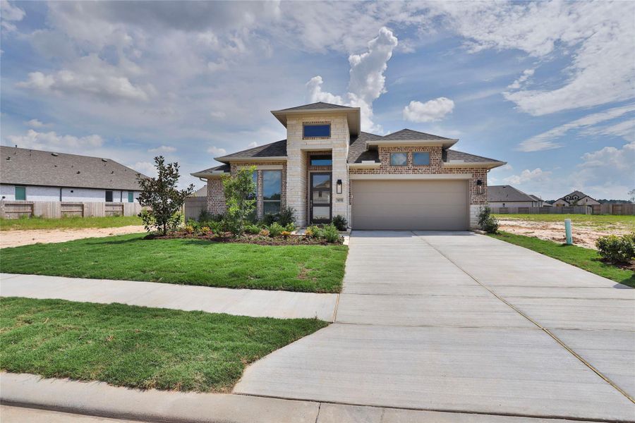 Front exterior of a new home in Artavia, Conroe, TX, highlighting curb appeal (Image 1). Front exterior of a new home in Artavia, Conroe, TX, highlighting curb appeal (Image 1).