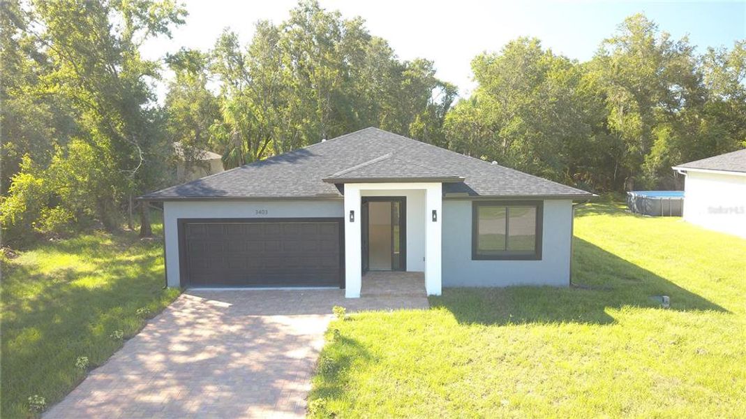Front exterior of a new home in , North Port, FL, highlighting curb appeal (Image 1). Front exterior of a new home in , North Port, FL, highlighting curb appeal (Image 1).