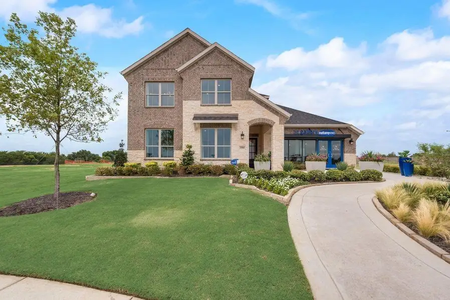 Front exterior of a new home in Valencia On The Lake, Little Elm, TX, highlighting curb appeal (Image 18).