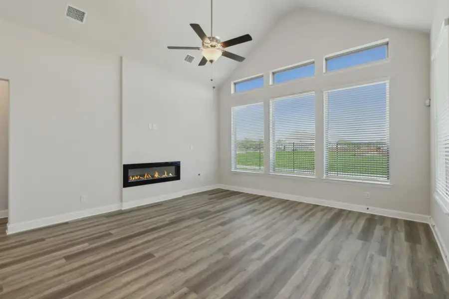 Representative unfurnished interior of a home built from the Raleigh by Chesmar Homes in Oaks of North Grove, Waxahachie (Image 8).