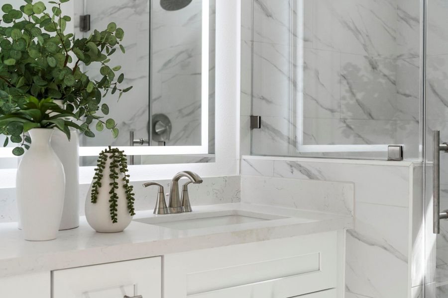 Bathrooms tout Moen faucets in a brushed nickel finish