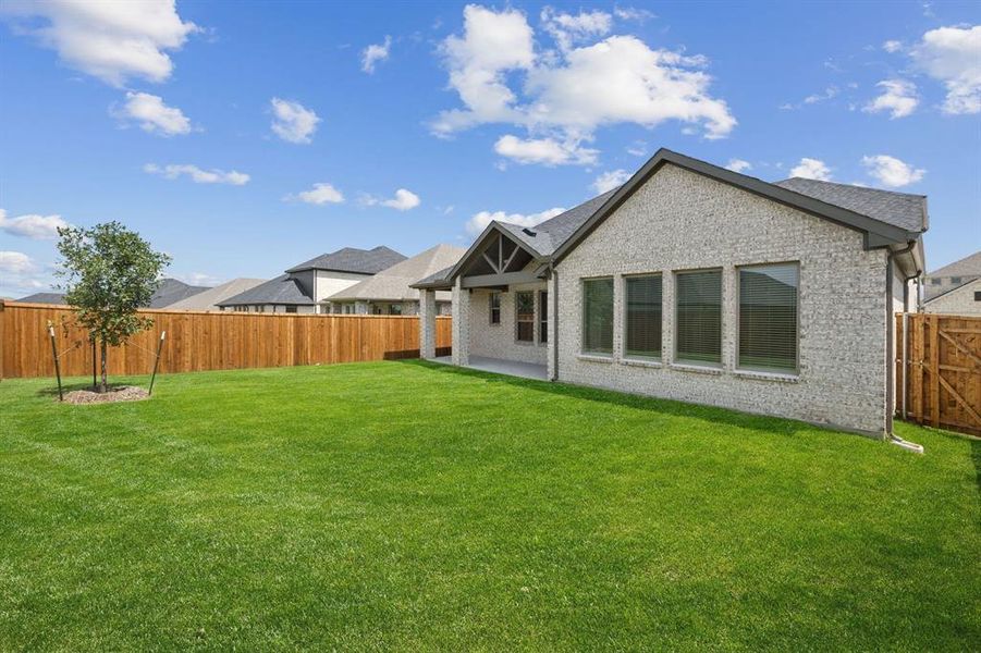 Patio in the Claret home plan by Trophy Signature Homes  REPRESENTATIVE PHOTO