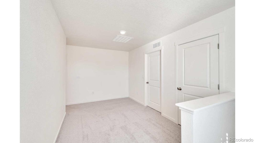 Spacious, unfurnished interior of a new home in The Ridge at Lorson Ranch, Colorado Springs (Image 11).
