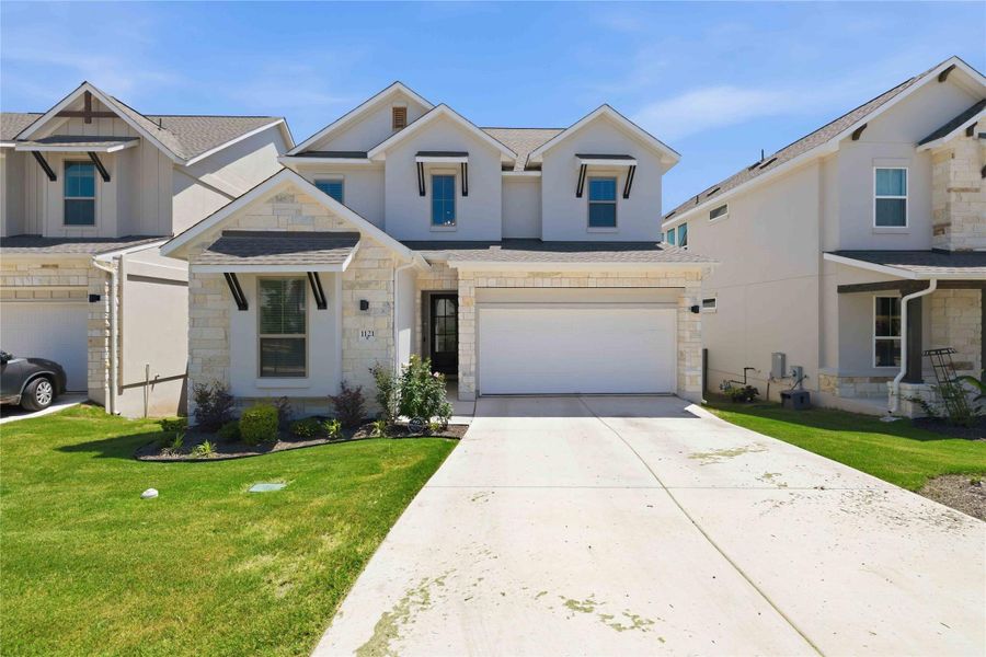 Front exterior of a new home in , Georgetown, TX, highlighting curb appeal (Image 25). Front exterior of a new home in , Georgetown, TX, highlighting curb appeal (Image 25).