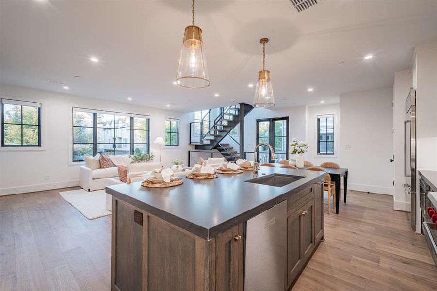 Stairway featuring built in shelves, a fireplace, and hardwood / wood-style floors