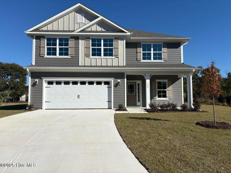 Front exterior of a new home in Fairfield Harbour, New Bern, NC, highlighting curb appeal (Image 1).