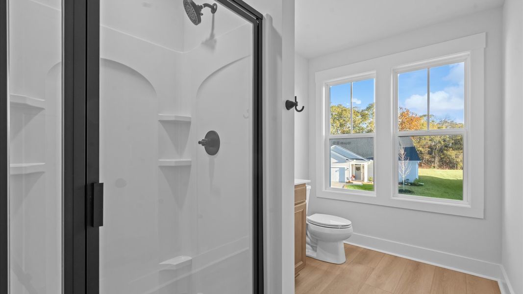 Elegant bath retreat with designer finishes and a clean, timeless aesthetic