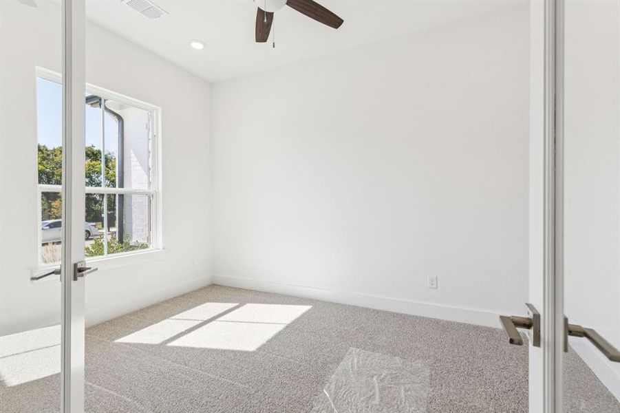 The professional working from home will appreciate this light, bright and private home office.