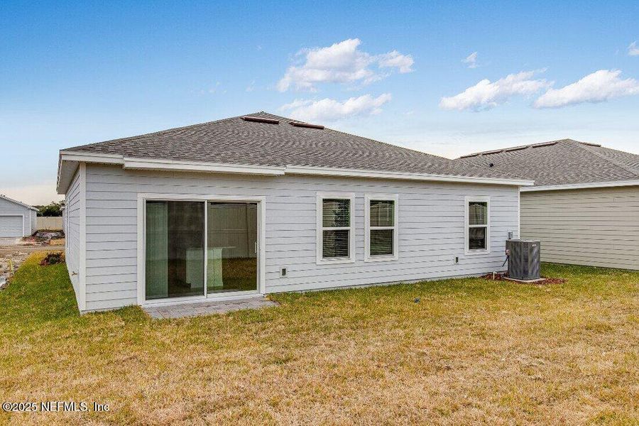 Front exterior of a new home in Coopers Meadow, Jacksonville, FL, highlighting curb appeal (Image 17).