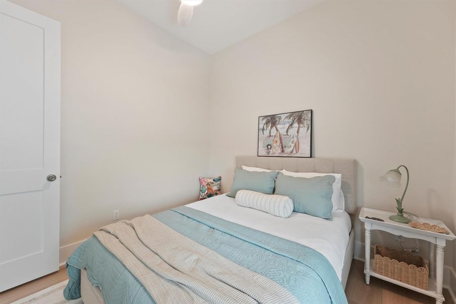 A calming guest retreat with soft coastal hues and abundant natural light. A calming guest retreat with soft coastal hues and abundant natural light.