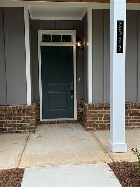 Front exterior of a new home in , Gainesville, GA, highlighting curb appeal (Image 1).