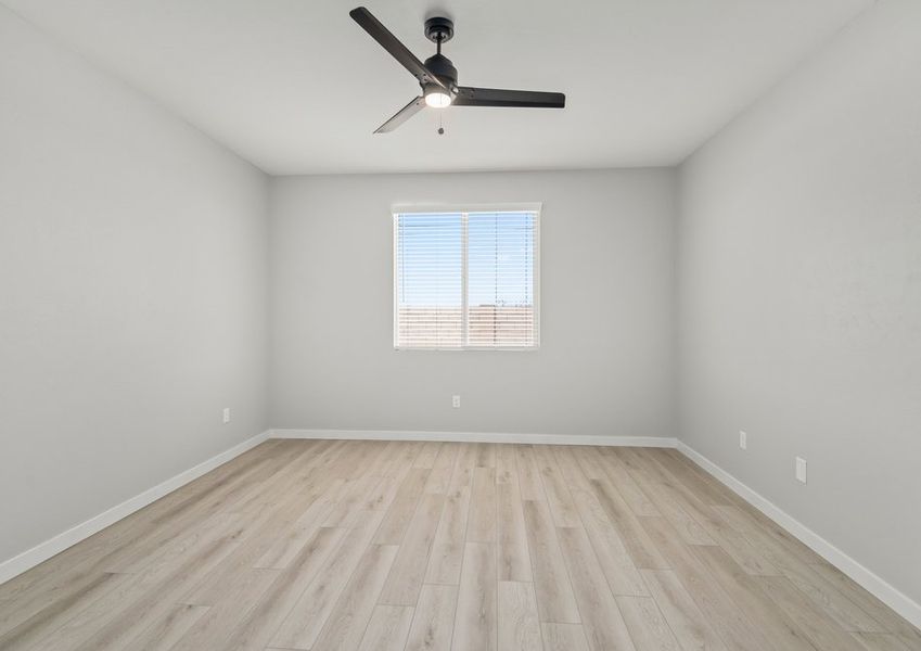 The master bedroom features vinyl floors and a ceiling fan.