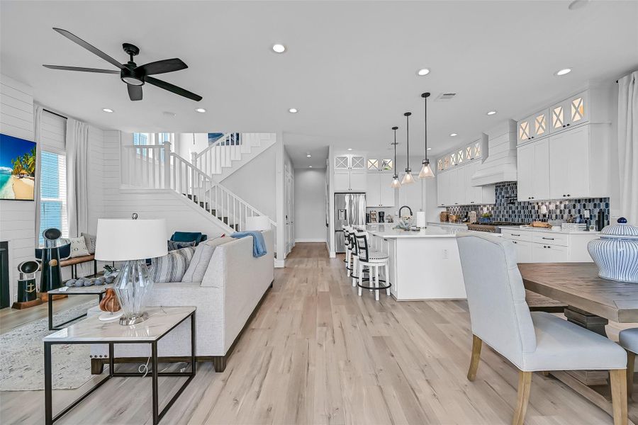 The kitchen was built to impress with quartz countertops, pendant lighting, soft close cabinetry, and a large breakfast bar. It’s equal parts functional and beautiful.