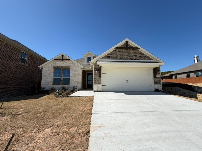 Front exterior of a new home in Waterford Park, Weatherford, TX, highlighting curb appeal (Image 1). Front exterior of a new home in Waterford Park, Weatherford, TX, highlighting curb appeal (Image 1).