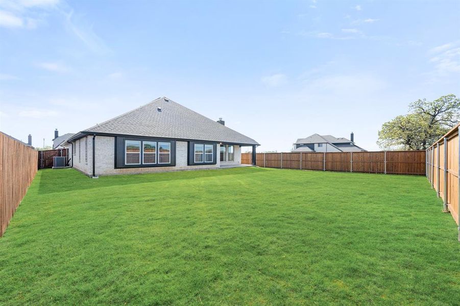 Exterior details and patio area of a home in Mockingbird Hills, Joshua (Image 22).