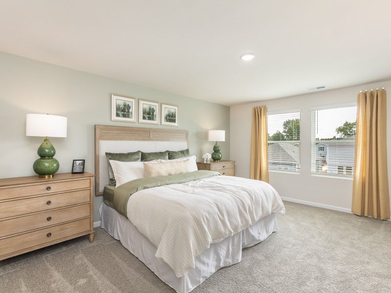 Primary bedroom in the Chatham floorplan at a Meritage Homes community in Angier, NC.