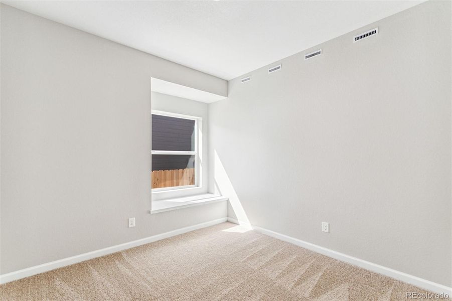 Spacious, unfurnished interior of a new home in Second Creek Farm, Commerce City (Image 13).