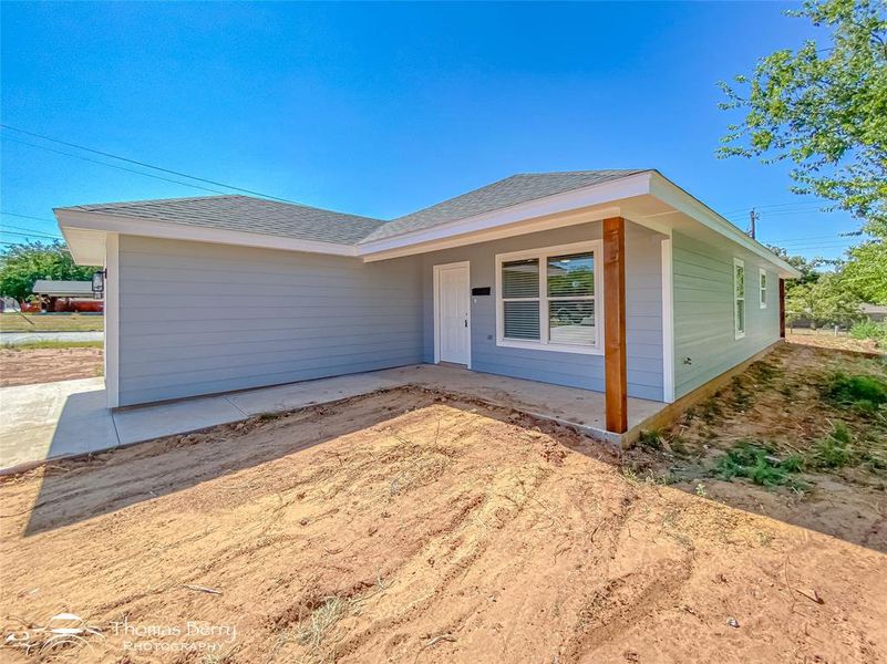 Ranch-style house with a shingled roof Ranch-style house with a shingled roof