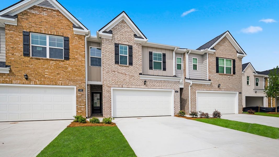 Front exterior of a new home in Independence Villas and Townhomes, Loganville, GA, highlighting curb appeal (Image 2). Front exterior of a new home in Independence Villas and Townhomes, Loganville, GA, highlighting curb appeal (Image 2).