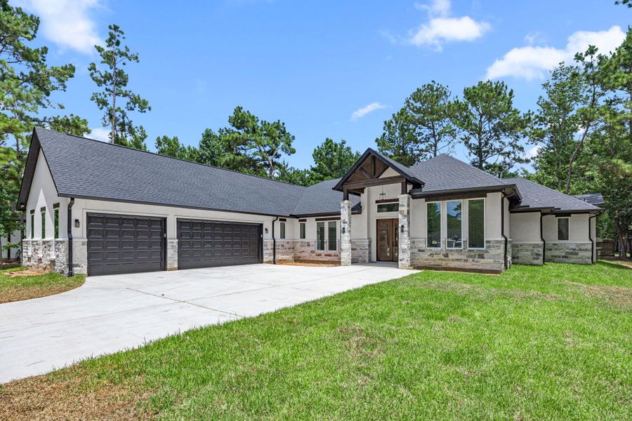 Front exterior of a new home in , Magnolia, TX, highlighting curb appeal (Image 1). Front exterior of a new home in , Magnolia, TX, highlighting curb appeal (Image 1).
