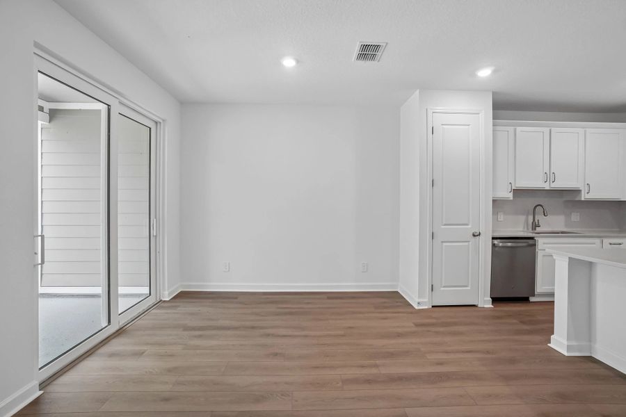 Dining space located off the kitchen and looks out on to the covered lanai