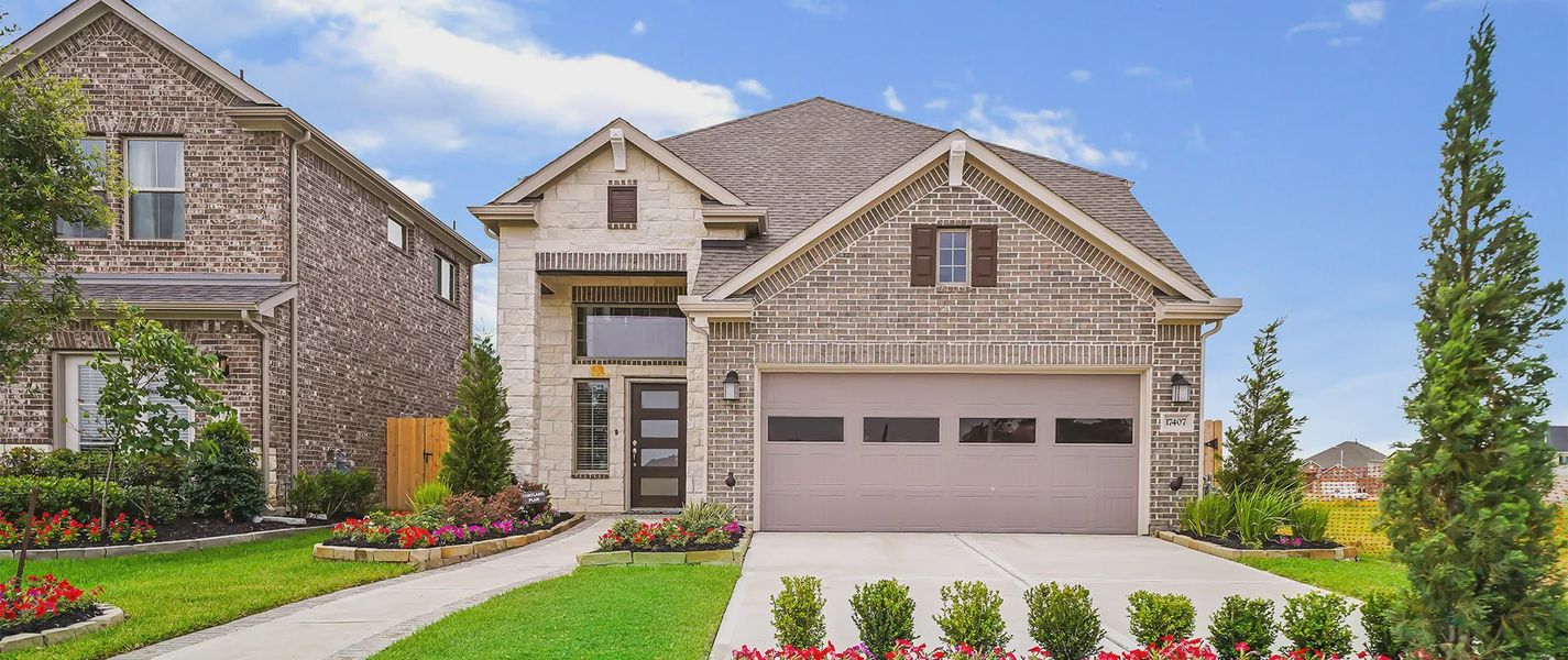 Representative exterior photo of a completed home built from the Portland by Chesmar Homes in Wood Leaf Reserve, Tomball, TX (Image 17).