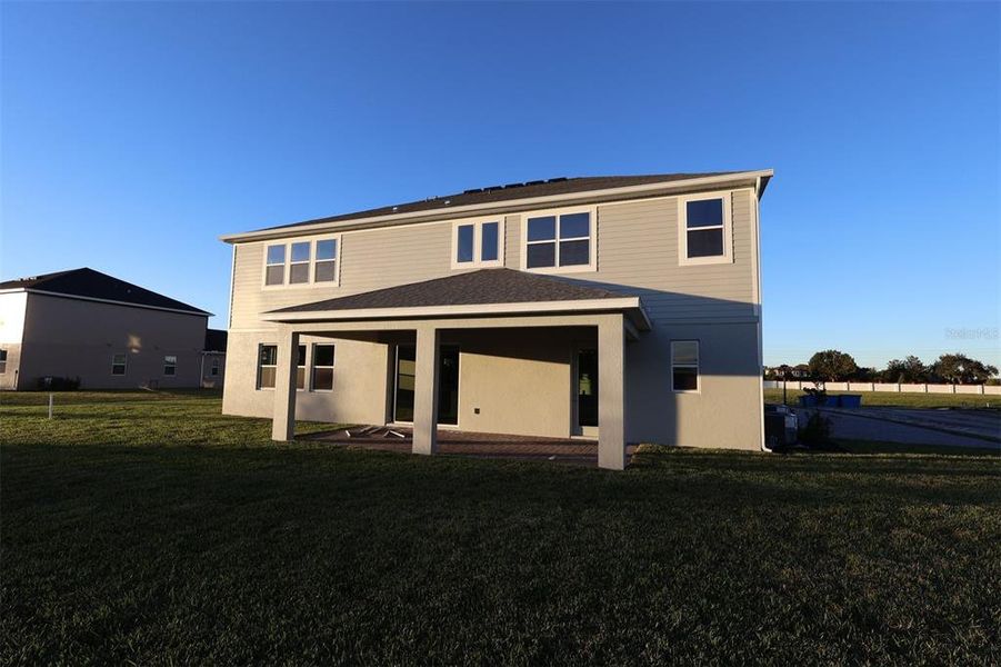 Exterior details and patio area of a home in Solace at Corner Lake, Orlando (Image 4). Exterior details and patio area of a home in Solace at Corner Lake, Orlando (Image 4).