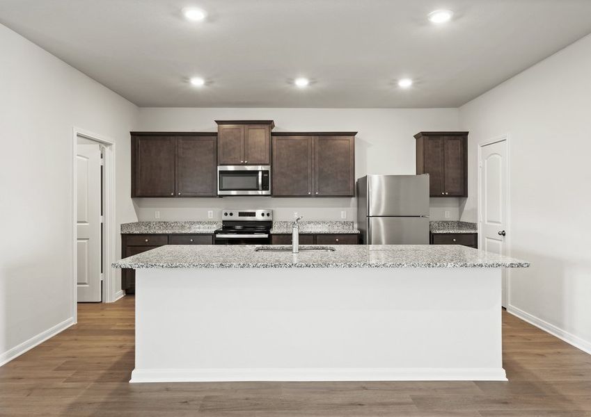 The kitchen has a convenient kitchen island. The kitchen has a convenient kitchen island.