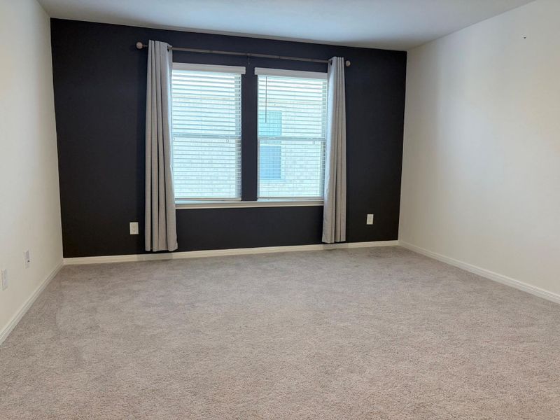 Spacious, unfurnished interior of a new home in Sunterra, Katy (Image 27).