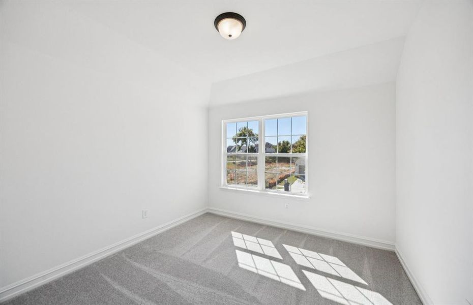 Comfortable bedroom with a bright window view Comfortable bedroom with a bright window view