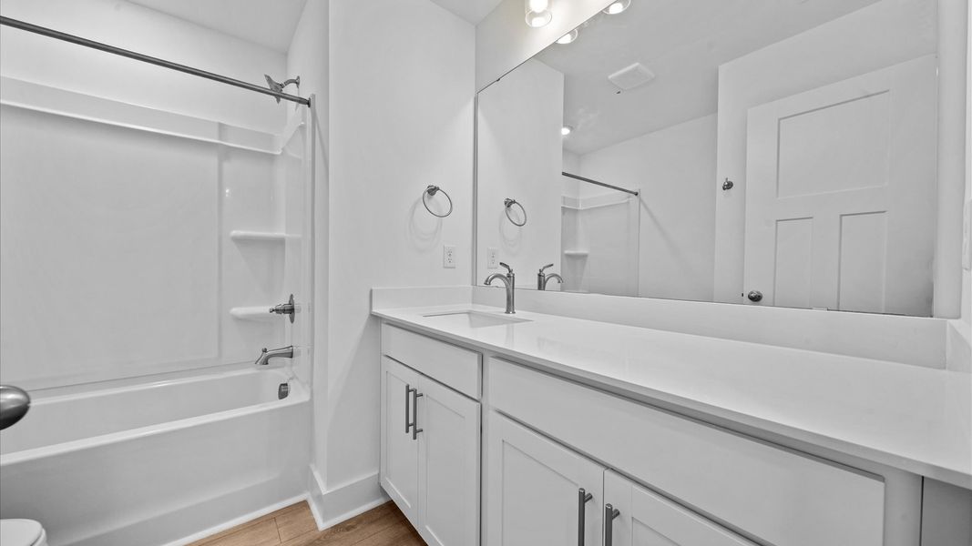 Elegant bath retreat with designer finishes and a clean, timeless aesthetic Elegant bath retreat with designer finishes and a clean, timeless aesthetic