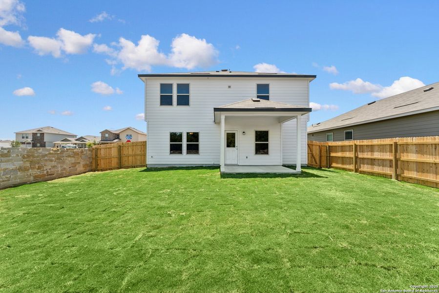 Front exterior of a new home in Cinco Lakes, San Antonio, TX, highlighting curb appeal (Image 14). Front exterior of a new home in Cinco Lakes, San Antonio, TX, highlighting curb appeal (Image 14).