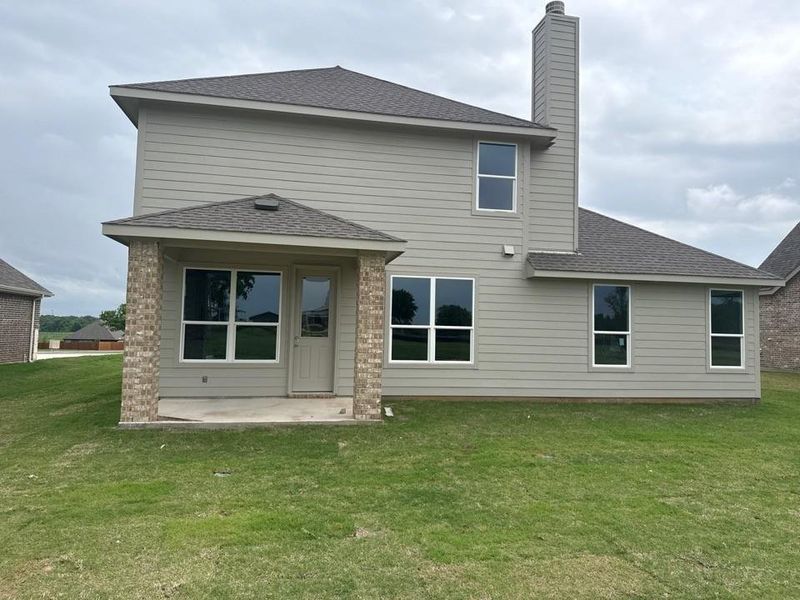 Exterior details and patio area of a home in Covenant Springs, Springtown (Image 3).