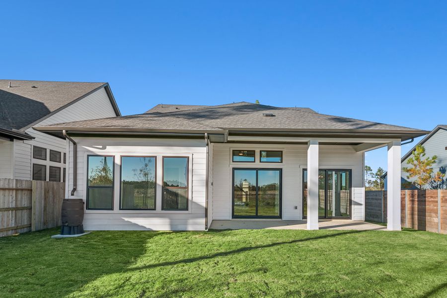 Exterior details and patio area of a home in ARTAVIA - Enclave Collection, Conroe (Image 29).
