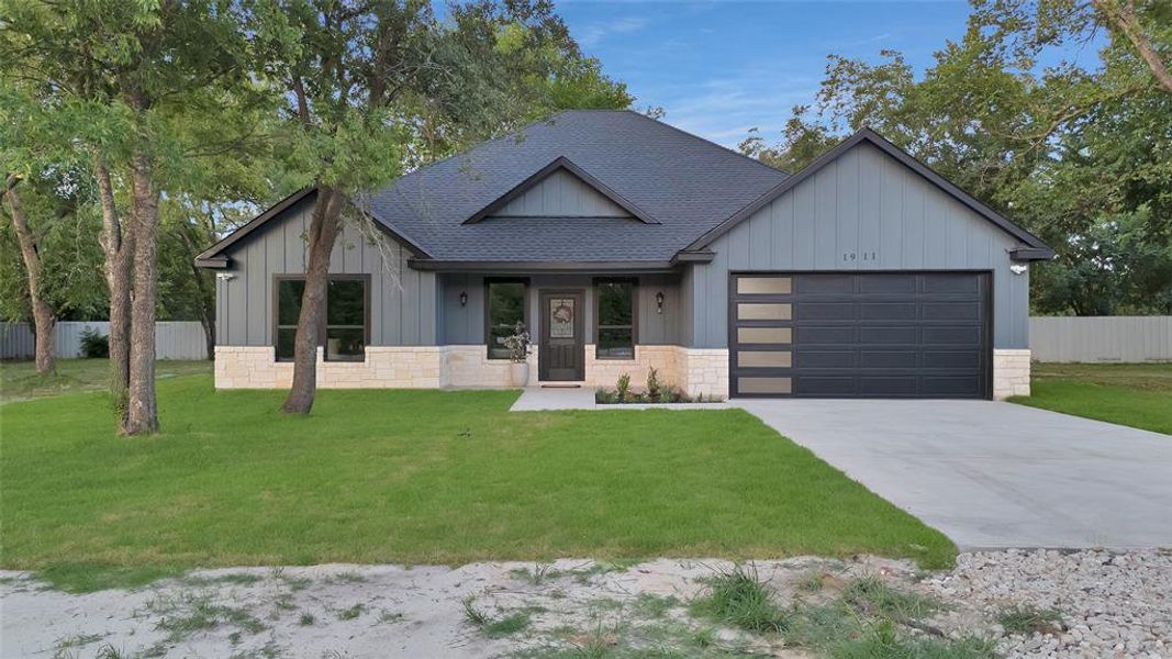 Front exterior of a new home in , Greenville, TX, highlighting curb appeal (Image 16). Front exterior of a new home in , Greenville, TX, highlighting curb appeal (Image 16).