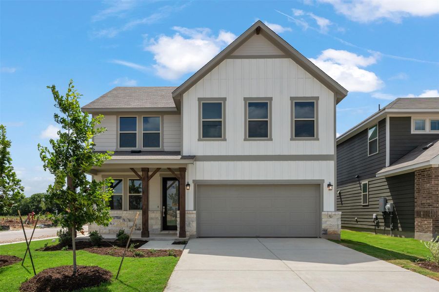 Front exterior of a new home in Cannon Ranch, Dripping Springs, TX, highlighting curb appeal (Image 1). Front exterior of a new home in Cannon Ranch, Dripping Springs, TX, highlighting curb appeal (Image 1).
